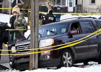Members of law enforcement work the scene following a suspected shooting by an ICE agent during federal law enforcement operations on Jan. 7, 2026, in Minneapolis, Minnesota.