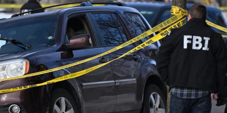 A bullet hole is in the windshield of a car from a shooting involving an ICE officer on Jan. 7, 2025 in Minneapolis.