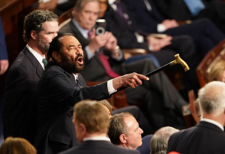 US Representative Al Green (D-TX) (L) disrupts US President Donald Trump  as he addressed to a joint session of Congress at the US Capitol in Washington, DC, on March 4, 2025. (Photo by ALLISON ROBBERT / AFP) (Photo by ALLISON ROBBERT/AFP via Getty Images)