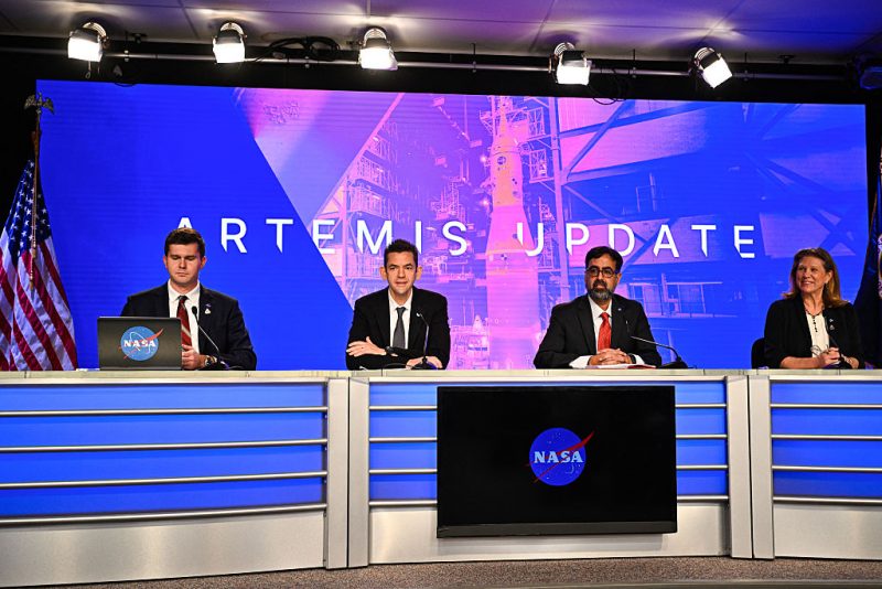 NASA Administrator Jared Isaacman (2L), NASA Associate Administrator Amit Kshatriya (2R), and Lori Glaze (R), associate administrator for NASA's Exploration Systems Development Mission Directorate, speak during a press conference to provide an update on the Artemis II mission at the Kennedy Space Center in Cape Canaveral, Florida, on February 27, 2026. NASA on Friday said it would revise its Artemis lunar program, which has suffered multiple delays in recent years, to ensure Americans can return to the Moon's surface by 2028. NASA will add missions between this spring's Artemis 2 and the ultimate moonwalk, a strategical revision NASA administrator Jared Isaacman told a briefing would allow for improved launch "muscle memory." The shift in plans comes as Artemis 2, which will see the first flyby of the Moon in more than half-a-century, has been plagued with delays and technical difficulties. (Photo by Miguel J Rodriguez Carrillo / AFP via Getty Images)