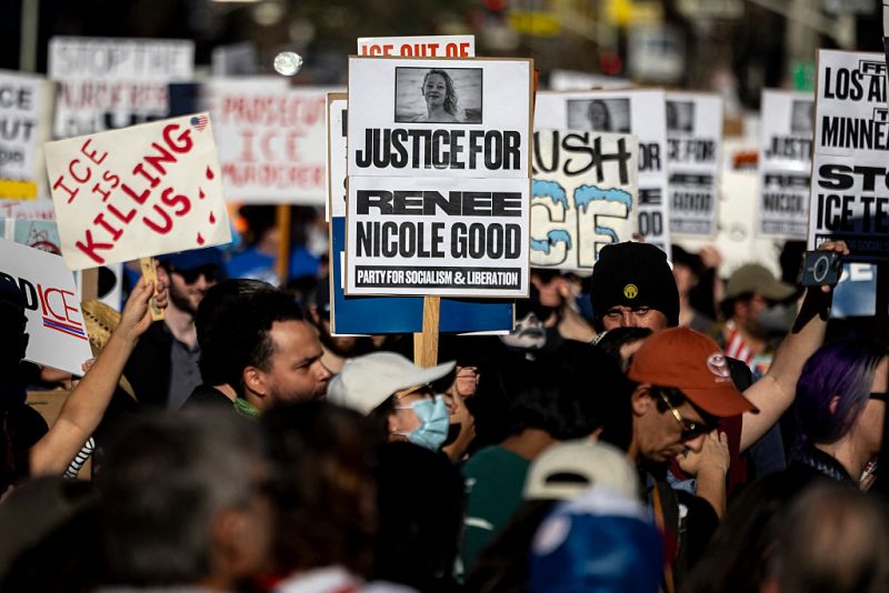 People hold signs as they protest in Los Angeles, California on January 10, 2026 against US Immigration and Customs Enforcement (ICE) after the fatal shooting of Renee Nicole Good in Minneapolis. A US Immigration and Customs Enforcement (ICE) agent shot and killed 37-year-old Renee Nicole Good on the streets of Minneapolis on January 7, leading to huge protests and outrage from local leaders who rejected White House claims she was a domestic terrorist. (Photo by ETIENNE LAURENT / AFP via Getty Images)