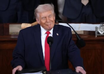 President Donald Trump grins while delivering his State of the Union address Tuesday in the Capitol.