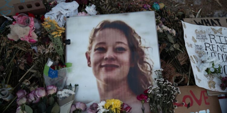 A picture of Renee Good is covered with flowers at a memorial on Jan. 29, 2026, in Minneapolis, Minnesota.