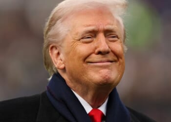 President Donald Trump grins in a file photo from the Dec. 13, Army-Navy Game in Baltimore.