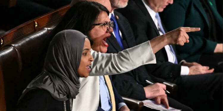 Democratic Rep. Rashida Tlaib of Michigan shouts while pointing a finger at President Donald Trump during Trump's State of the Union address in the Capitol on Tuesday.