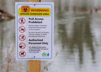 A notice alerting of a sewage overflow area is posted along the Potomac River Thursday in Cabin John, Maryland. This week District of Columbia Mayor Muriel Bowser declared a public emergency for the sewage spill in the Potomac River, 30 days after a section of a major pipe collapsed, unleashing millions of gallons of untreated sewage into the river.