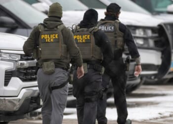 ICE agents depart the Bishop Henry Whipple Federal Building on Feb. 4, 2026, in Minneapolis, Minnesota.