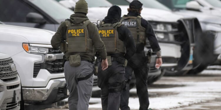 ICE agents depart the Bishop Henry Whipple Federal Building on Feb. 4, 2026, in Minneapolis, Minnesota.