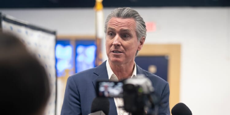 California Gov. Gavin Newsom speaks with reporters Monday during an event hosted by the South Carolina Democratic Party in Manning, South Carolina.