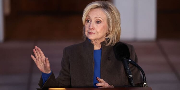 Former Secretary of State Hillary Clinton speaks to the news media Thursday after her deposition with the House Oversight Committee as they investigate links to convicted sex offender Jeffrey Epstein, in Chappaqua, New York. Clinton testified behind closed doors before a congressional committee investigating Epstein and his accomplice, Ghislaine Maxwell.