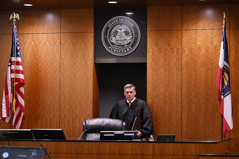 Judge Tony Graf of the 4th District Court in Provo, Utah, enters the courtroom as Tyler Robinson, the suspect in the killing of political activist Charlie Kirk, attends a court appearance remotely from his jail cell on September 16, 2025. Robinson has been formally charged with the murder of Kirk, and the prosecution added a notice of intent to seek the death penalty. Six other charges include obstruction of justice and witness tampering. Kirk, a close ally of President Donald Trump, was shot dead last week during a speaking event on a Utah university campus. (Photo by POOL / AFP) (Photo by -/POOL/AFP via Getty Images)