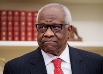 Supreme Court Associate Justice Clarence Thomas, seen in a 2025 photo, wrote a blistering dissent on the tariff ruling.