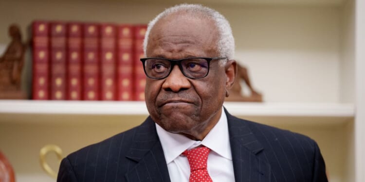 Supreme Court Associate Justice Clarence Thomas, seen in a 2025 photo, wrote a blistering dissent on the tariff ruling.