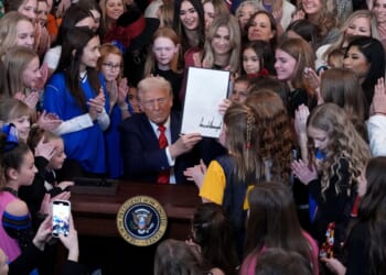 President Donald Trump was joined by women athletes as he signed the “No Men in Women’s Sports” executive order in the East Room at the White House on Feb. 5, 2025.