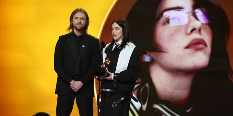 Finneas O'Connell and Billie Eilish stand on stage at the 68th GRAMMY Awards at Crypto.com Arena on Feb. 1, 2026.