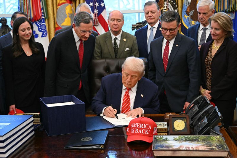 US President Donald Trump signs a funding bill to end a partial government shutdown in the Oval Office of the White House in Washington, DC, on February 3, 2026. The US House of Representatives passed a spending bill on Tuesday ending the four-day partial government shutdown sparked by Democratic opposition to funding for the federal agency carrying out President Donald Trump's immigration crackdown. (Photo by SAUL LOEB / AFP via Getty Images)