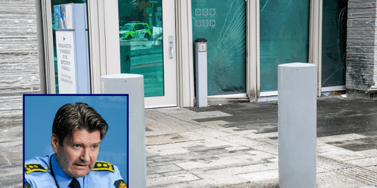 (Background) Damages at the US Embassy in Oslo, Norway, are pictured on March 8, 2026, some hours after a loud bang was reported at the site. The US embassy in Oslo was hit by an explosion in the early hours of Sunday, March 8, 2026, but no one was injured, police in the Norwegian capital said, adding the cause was not immediately known. (Photo by Fredrik Varfjell / NTB / AFP via Getty Images) / (L) Police Attorney Christian Hatlo addresses a press briefing at the police station in Gronland about new developments in the investigation into the explosion at the US embassy in Oslo on March 11, 2026. The blast took place at around 1:00 am (0000 GMT) on Sunday, March 8, at the entrance to the embassy