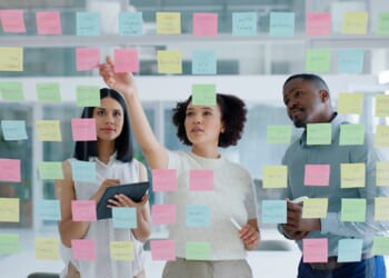 Business Team Looking at Sticky Notes