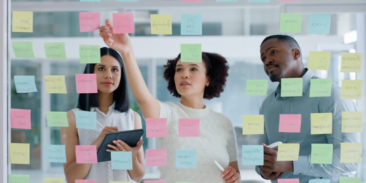 Business Team Looking at Sticky Notes