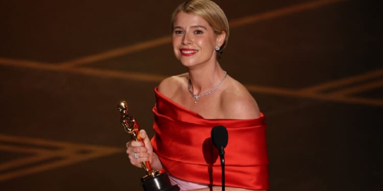 Irish actress Jessie Buckley accepts the award for Best Actress in a Leading Role for "Hamnet" onstage at the Dolby Theatre in Hollywood on Sunday.