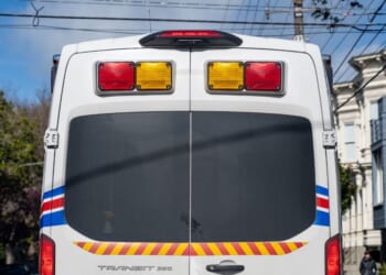 The rear view of a Medstar ambulance van on a city street with traffic signs and overhead wires visible in San Francisco, California, on Feb. 19, 2026.