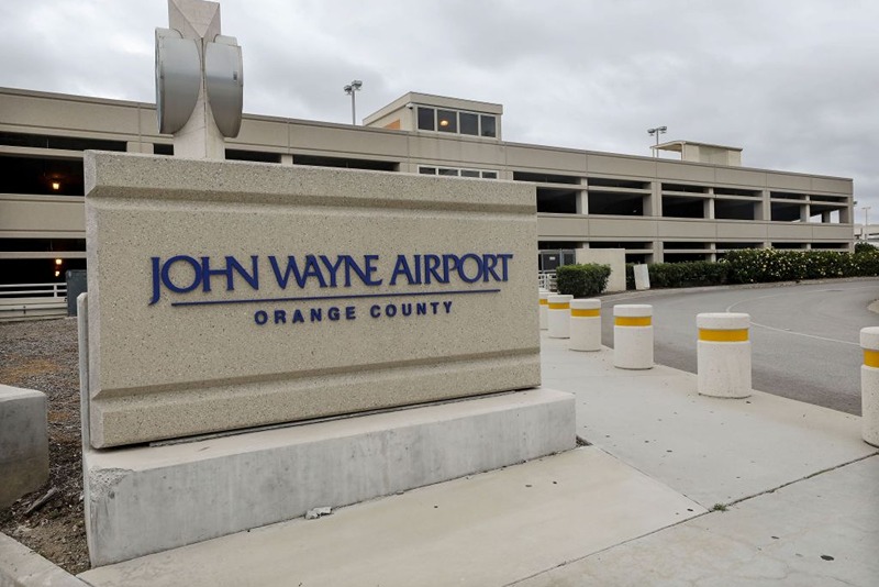 SANTA ANA, CALIFORNIA - JUNE 28: A sign is displayed at John Wayne Airport, located in Orange County, on June 28, 2020 in Santa Ana, California. Orange County Democrats are calling for the name of the airport to be changed due to the deceased actor's 'racist and bigoted statements'. (Photo by Mario Tama/Getty Images)
