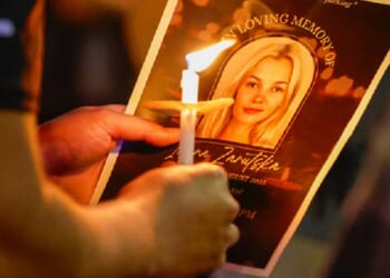 An image of murder victim Iryna Zarutska is pictured on a pamphlet at a vigil in her honor in September in Charlotte, North Carolina.