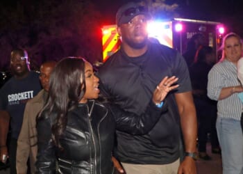 Rep. Jasmine Crockett, a Texas Democrat, is seen Feb. 27 with the security team member she said she knew as Mike King, but who was later identified as 39-year-old Diamon-Mazairre Robinson. Robinson was shot and killed March 11 in a standoff with Dallas police.