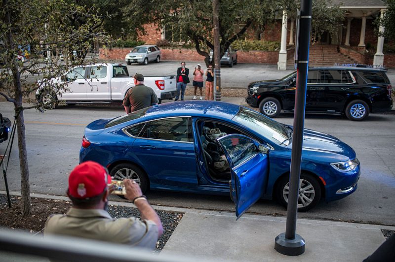 DALLAS, TEXAS - MARCH 3: Police surround a car of a man who was arrested after reportedly having several magazines of ammunition outside of a watch party for GOP Texas Senate Candidate Ken Paxton on March 3, 2026 in Dallas, Texas. Paxton is facing off against numerous candidates including incumbent Senator John Cornyn in the Republican Senate primary. (Photo by Sergio Flores/Getty Images)