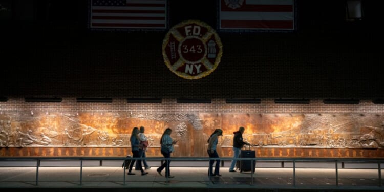 People walk by a Ground Zero memorial to the FDNY's lost members from 9/11 on Sept. 9, 2025, in New York City.