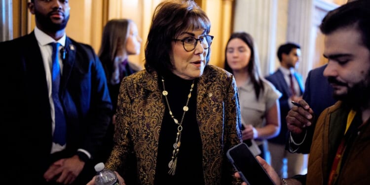 Sen. Jacky Rosen (D-NV) speaks to reporters as she walk into the Senate Chamber in Washington, DC on Dec. 11, 2025.