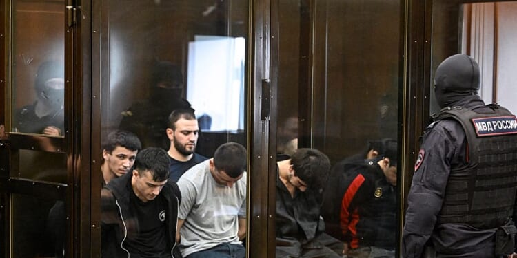 TOPSHOT - A group of defendants accused of involvement in the 2024 Crocus City Hall music venue gun attack that killed 149 people, goes on trial in Moscow on August 4, 2025. (Photo by Alexander NEMENOV / AFP) (Photo by ALEXANDER NEMENOV/AFP via Getty Images)