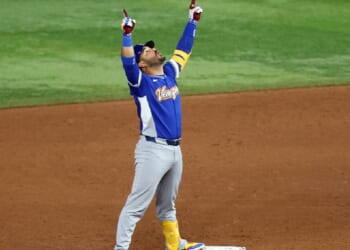 Eugenio Suárez of Team Venezuela points to the sky after hitting an RBI double against Team United States that gave Venezuela the winning run in the World Baseball Classic final on Tuesday at loanDepot Park in Miami.