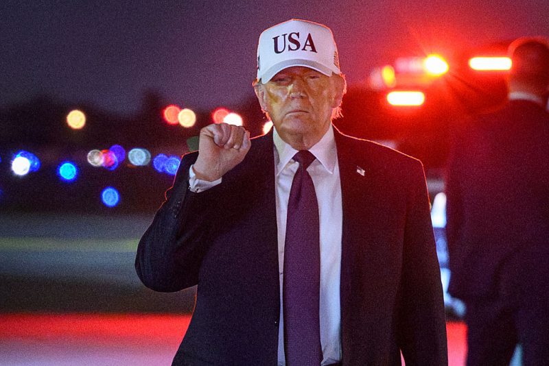 TOPSHOT - US President Donald Trump gestures as he arrives at Palm Beach International Airport in West Palm Beach, Florida on February 27, 2026. Trump is spending the weekend at his Mar-a-Lago resort. (Photo by Mandel NGAN / AFP via Getty Images)