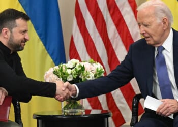 Ukrainian President Volodymyr Zelenskyy, left, shakes hands with then-Ppresident Joe Biden on June 7, 2024, during a bilateral meeting in Paris.