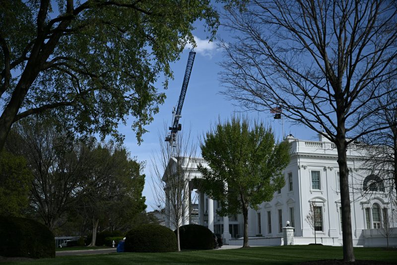 A crane working on US President Donald Trump's planned ballroom is seen at the White House in Washington, DC, on March 31, 2026. A US judge ordered a halt to construction of a massive ballroom launched by President Donald Trump after the tearing down of the historic East Wing at the White House. Trump is "steward" of the White House but "he is not, however, the owner!" wrote Judge Richard Leon, saying that congressional approval would be needed for the project. "No statute comes close to giving the president the authority he claims to have." (Photo by Brendan SMIALOWSKI / AFP via Getty Images)