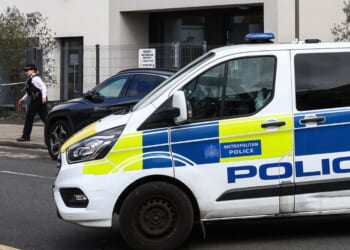 A police officer takes part in an investigation following an attack on Finchley Reform Synagogue in the North Finchley area of north London, on April 15, 2026, in the early hours of the morning.