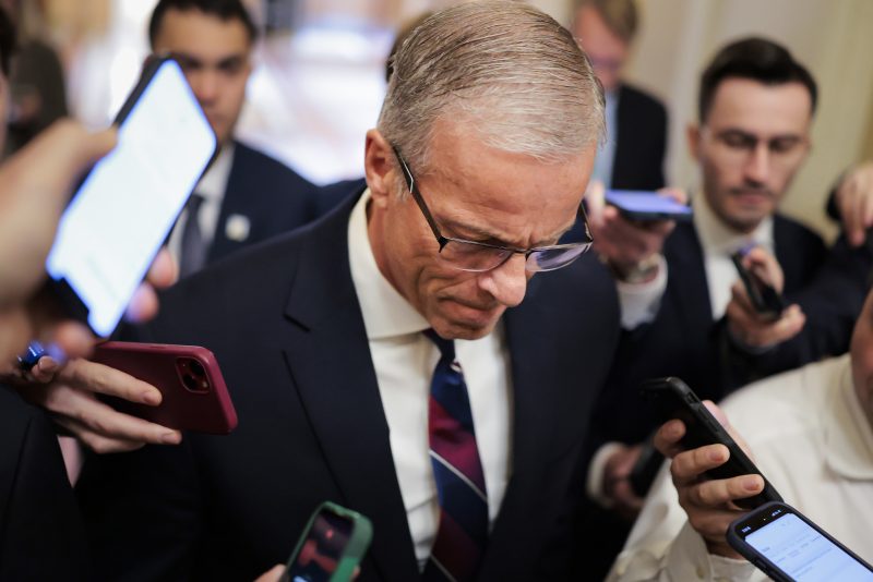 WASHINGTON, DC - APRIL 13: Senate Majority Leader John Thune (R-SD) speaks with press as he walks through the U.S. Capitol Building on April 13, 2026 in Washington, DC. Members of both the Senate and House of Representatives return to DC this week after recess for Easter and Passover. (Photo by Heather Diehl/Getty Images)