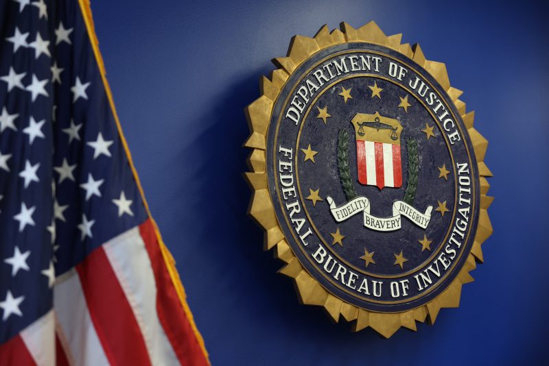 The logo of the Federal Bureau of Investigation (FBI) is seen at the Los Angeles Federal Building after a news conference to provide an update on the investigation into a May 18, 2025, bombing at a fertility clinic in Palm Springs, California, on June 4, 2025, in Los Angeles. Daniel Park, 32 from Washington state, was arrested by the FBI at John F. Kennedy International Airport on June 3, 2025, as he was arriving. He is a suspect in the investigation into the May 18, 2025, bombing at a fertility clinic in Palm Springs, California. (Photo by Patrick T. Fallon / AFP) (Photo by PATRICK T. FALLON/AFP via Getty Images)