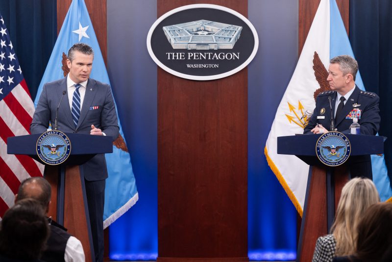 (L/R) US Secretary of Defense Pete Hegseth speaks alongside Chairman of the Joint Chiefs of Staff General Dan Caine during a press briefing at the Pentagon in Washington, DC, on April 16, 2026. The United States will prevent all shipping from entering or exiting Iranian ports in the Strait of Hormuz for "as long as it takes," US Defense Secretary Pete Hegseth said on Thursday, the fourth day of the blockade. (Photo by SAUL LOEB / AFP via Getty Images)