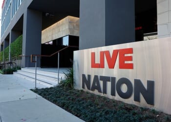 BEVERLY HILLS, CALIFORNIA - MARCH 09: The Live Nation logo is displayed at a Live Nation corporate office on March 9, 2026 in Beverly Hills, California. Live Nation has reportedly reached a tentative settlement with the Department of Justice that would require Live Nation, the owner of Ticketmaster, to pay around $200 million in damages. (Photo by Mario Tama/Getty Images)