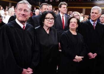 Supreme Court Chief Justice John Roberts, left, and Associate Justices Sonia Sotomayor, Elena Kagan, Neil Gorsuch, and Brett Kavanaugh stand on the House floor ahead of the annual State of the Union address by then- President Joe Biden before a joint session of Congress on March 7, 2024.