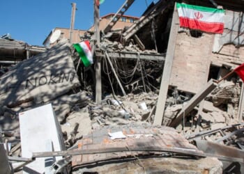 Iranian flags and graffiti seen at the remains of Sharif University of Technology in Tehran, Iran on April 7, 2026.