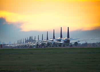 Airplanes lined up on a tarmac