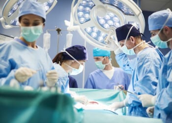 Health care team performing surgery