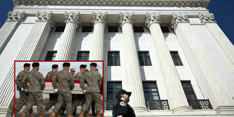 (Background) A Supreme Court Police Officer walks along the back side of the US Supreme Court as President Donald Trump attends oral arguments, in Washington, DC on April 1, 2026. President Donald Trump will watch the US Supreme Court hear a landmark case weighing the constitutionality of his contentious bid to end birthright citizenship, an extraordinary and possibly unprecedented move for the nation