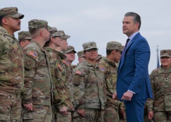 Secretary of War Pete Hegseth congratulates a group of National Guard troops after administering their re-enlistment ceremony at the base of the Washington Monument on Feb. 6, 2026, in Washington, D.C.