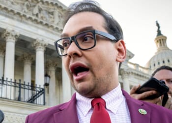 Disgraced former GOP Rep. George Santos of New York is seen speaking to reporters outside the Capitol in Washington, D.C., in a file photo dated May 17, 2023. Santos told conservative podcaster Benny Johnson that the House Congressional page program had to be shut down years ago because of lawmaker assaults on the teen participants.