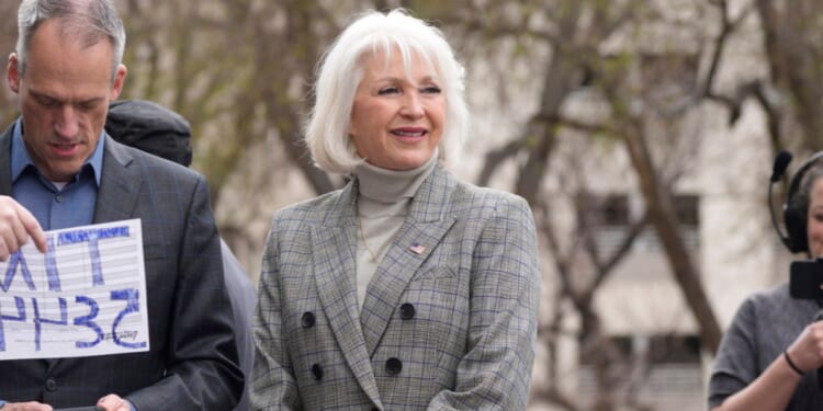 Mesa County Colorado clerk Tina Peeters walks on the steps of the state Capitol on April 5, 2022.