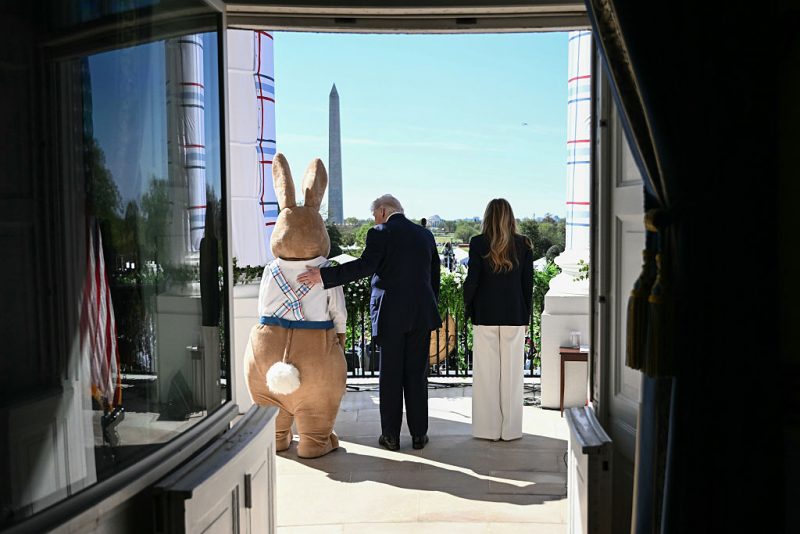 WASHINGTON, DC - APRIL 06: U.S. President Donald Trump and first lady Melania Trump arrive with the Easter Bunny on the balcony for the White House Easter Egg Roll on the South Lawn of the White House on April 06, 2026 in Washington, DC. The Easter Egg Roll is a White House tradition dating back to 1878. The Trumps also honored the 250th anniversary of the United States during the event. (Photo by Brendan Smialowski-Pool/Getty Images)